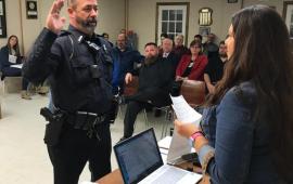 City Clerk Lesley Shook swears in Patrick Shook to the Arkansas City Police Department.  