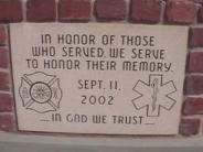 9/11 Plaque - "In honor of those who served. We serve to honor their memory. Sept. 11 2002. In God We Trust"