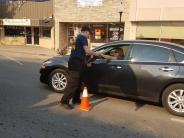 Fire-EMS member taking MDA donation from person in their car